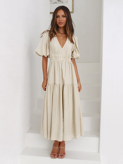 Jurk met pofmouwen en getailleerde taille - By LAQUEZ.