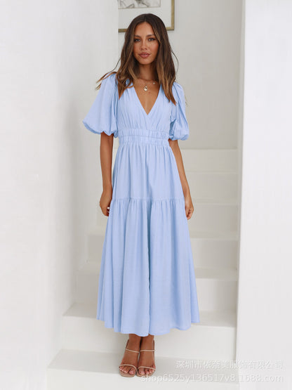 Jurk met pofmouwen en getailleerde taille - By LAQUEZ.