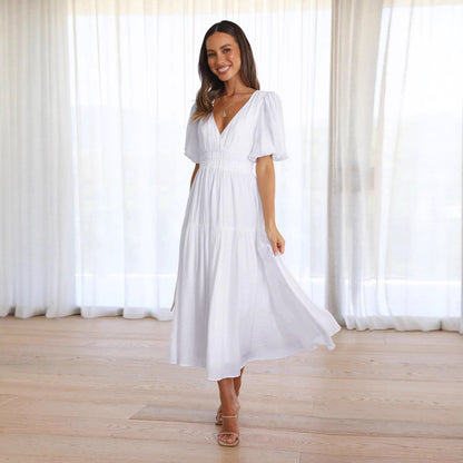 Jurk met pofmouwen en getailleerde taille - By LAQUEZ.